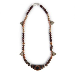 Dzi focal fine double sided bead with traditional Hindu symbols, carved carnelian spacers, old silver rounds, mixed rosewood and carved wooden beads with small old tribal prayer amulets, sterling clasp - Image 1