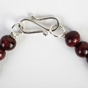 Dzi focal fine double sided bead with traditional Hindu symbols, carved carnelian spacers, old silver rounds, mixed rosewood and carved wooden beads with small old tribal prayer amulets, sterling clasp - Image 4
