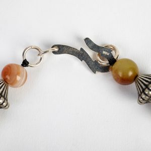 Dzi exceptional  carnelian focal, mixed carnelian and pomtek beads with Navajo sterling spacers and sterling hook closure - Image 4